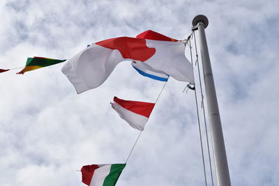 Low angle view of flag against sky