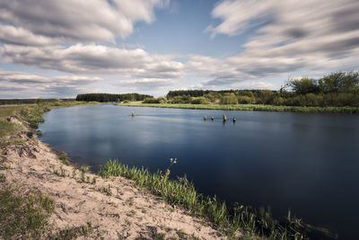 View of lake against cloudy sky