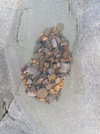 High angle view of stones on pebbles