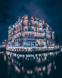 Illuminated buildings in city at night