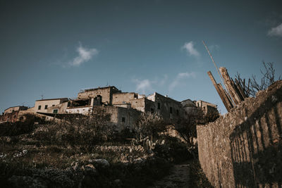 Low angle view of old building against sky