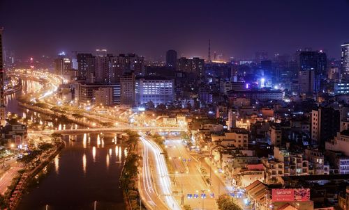 High angle view of illuminated buildings in city at night