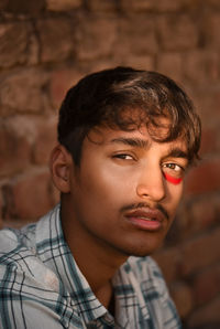 Close-up portrait of young man with face paint