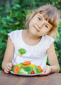 Portrait of young woman having food