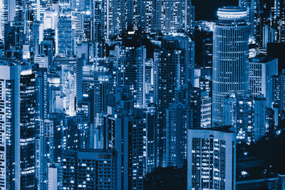 High angle view of illuminated buildings in city at night