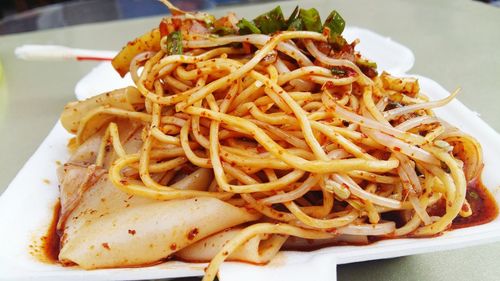 Close-up of spaghetti served on plate