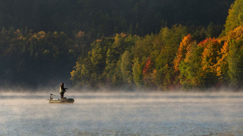 Scenic view of lake in forest during autumn