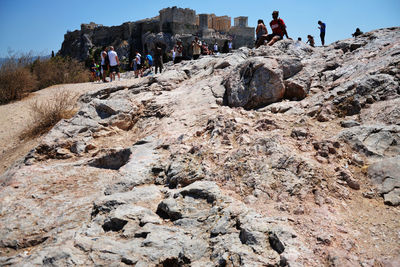 People walking on rock