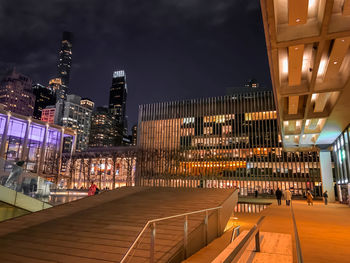 Illuminated buildings in city at night