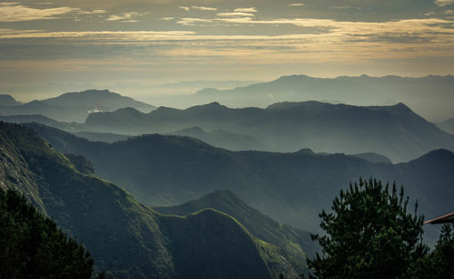 Scenic view of mountains against sky at sunset