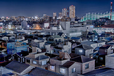 High angle view of buildings in city against sky
