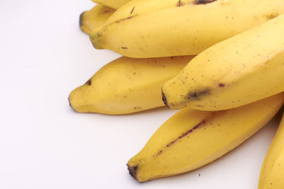 High angle view of bananas on white background