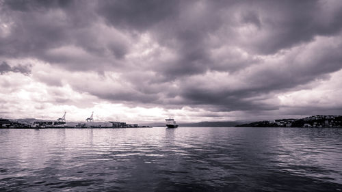 Scenic view of sea against cloudy sky