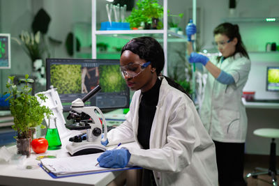 Female dentist examining patient at clinic