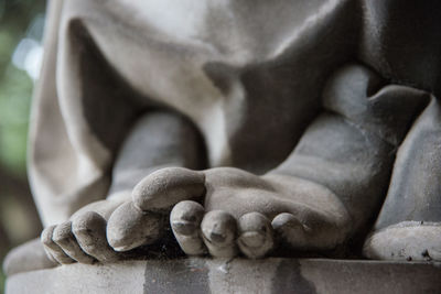 Close-up of hands statue