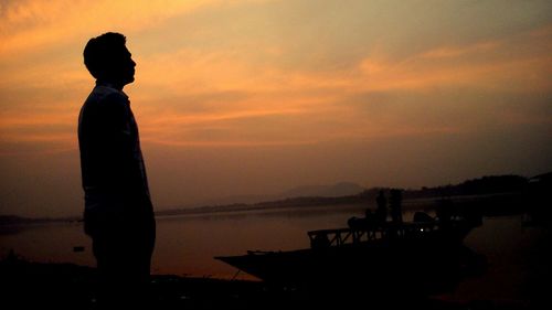 Silhouette of people at sunset