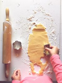 Close-up of hand making cookies