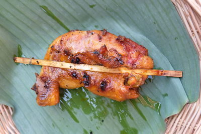 High angle view of meat on barbecue grill