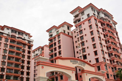 Low angle view of buildings against sky in city