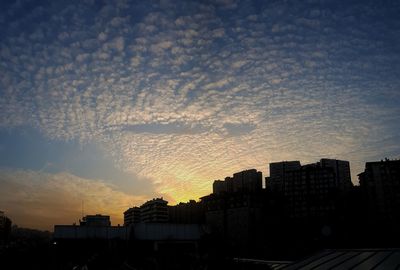 Cityscape against sky during sunset