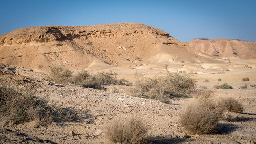 Scenic view of desert against clear sky