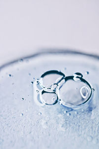 Close-up of water splashing against blue background