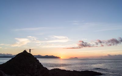 Scenic view of sea at sunset