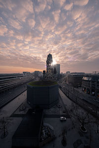 High angle view of buildings in city during sunset