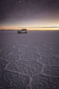 Car under the stars in uyuni salar