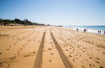 View of beach against clear sky