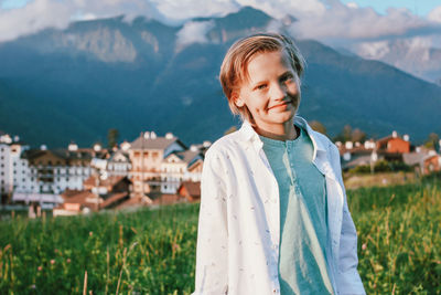 Portrait of smiling girl on field