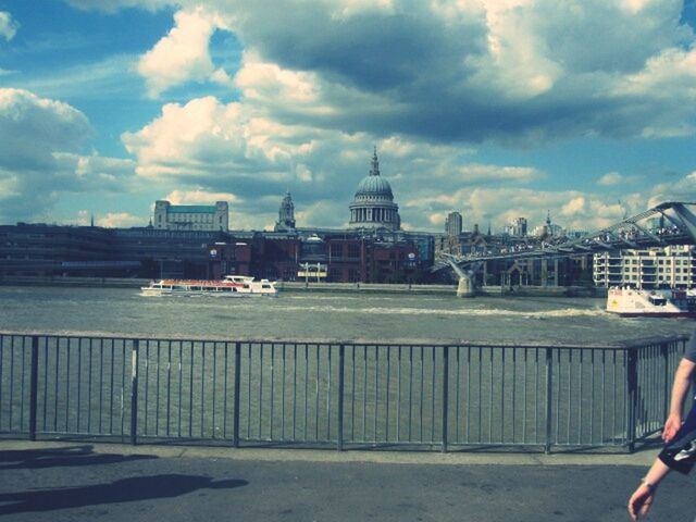 architecture, building exterior, built structure, sky, nautical vessel, transportation, water, city, cloud - sky, mode of transport, travel, travel destinations, boat, river, cloud, tourism, men, sea, cityscape