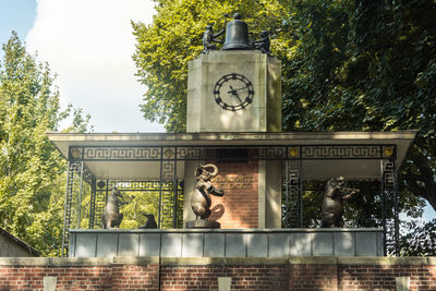 Statue against trees and plants