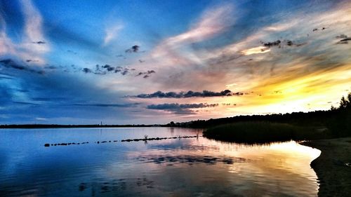 Scenic view of sea against sky at sunset