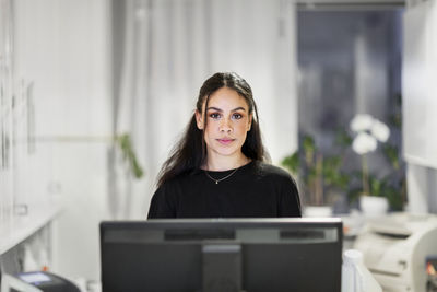 Receptionist looking at camera