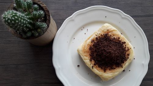 High angle view of coffee in plate on table
