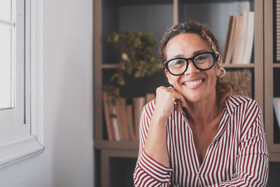 Portrait of smiling woman at home