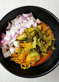High angle view of chopped vegetables in bowl on table