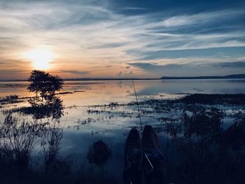 Scenic view of lake against sky during sunset