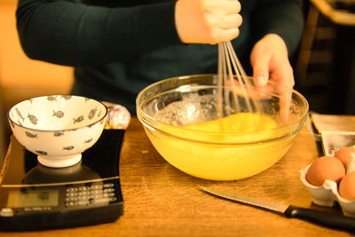 Midsection of man preparing food on table