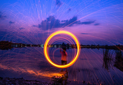 Light trails against sky at night