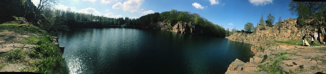 Panoramic view of river amidst trees in forest against sky