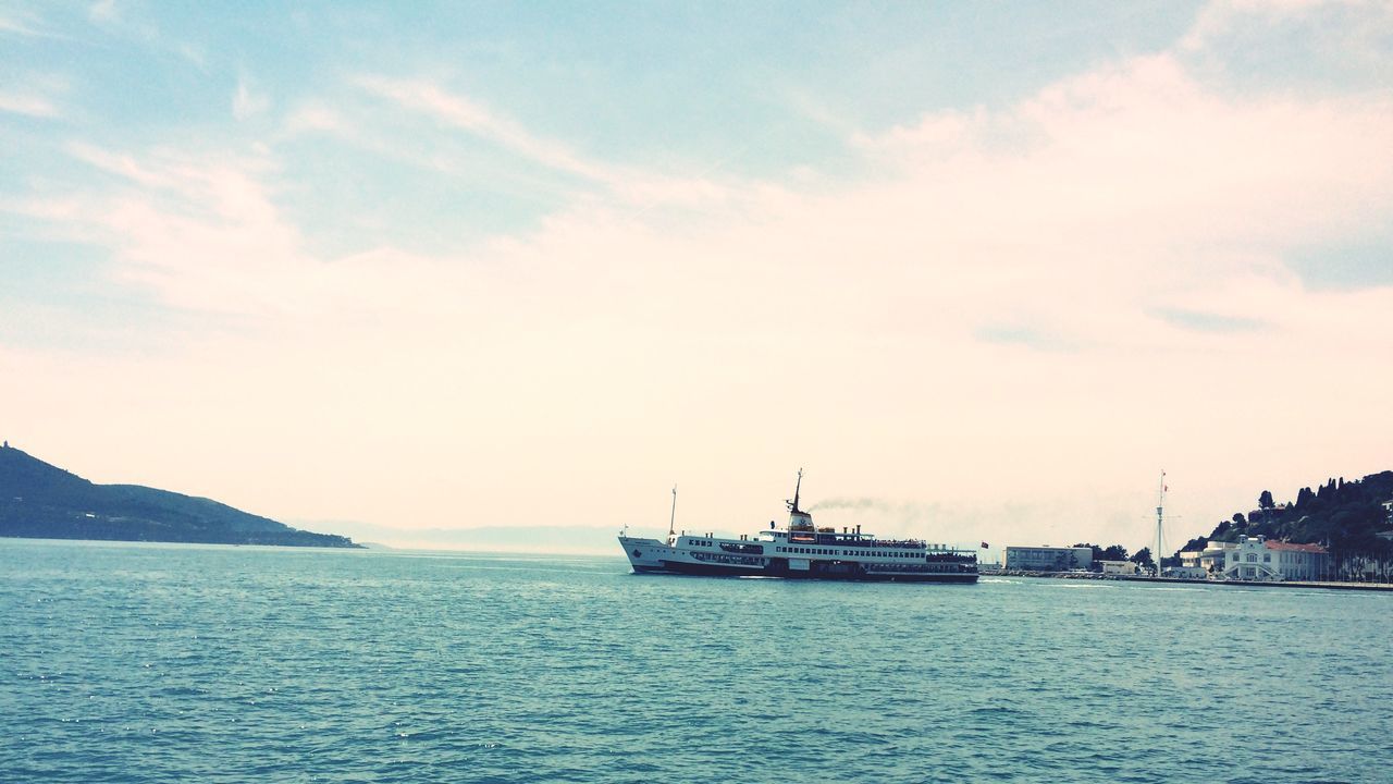 sea, water, waterfront, nautical vessel, transportation, mode of transport, sky, boat, tranquil scene, scenics, horizon over water, tranquility, beauty in nature, sailing, nature, cloud - sky, rippled, cloud, outdoors, idyllic