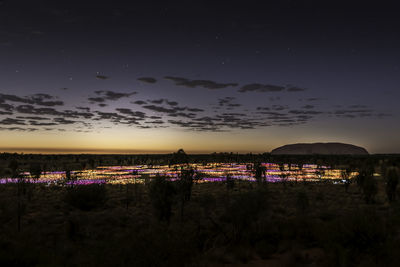 Scenic view of illuminated city against sky at night