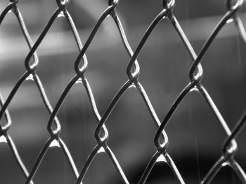 Full frame shot of chainlink fence against sky