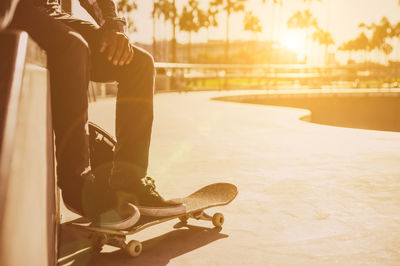 Low section of man skateboarding on skateboard