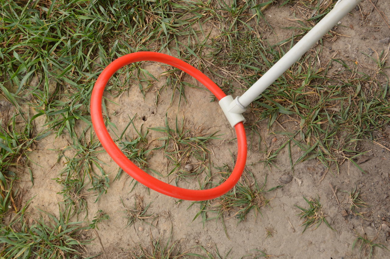 HIGH ANGLE VIEW OF BICYCLE IN FIELD