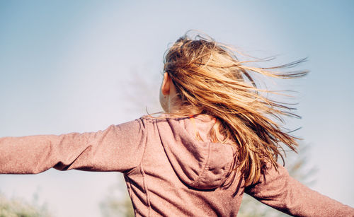 Portrait of woman against sky