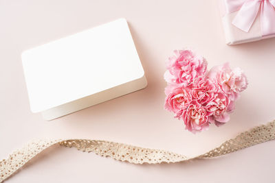 High angle view of pink flower on table