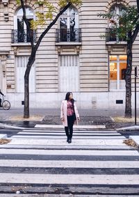 Full length of woman standing on street